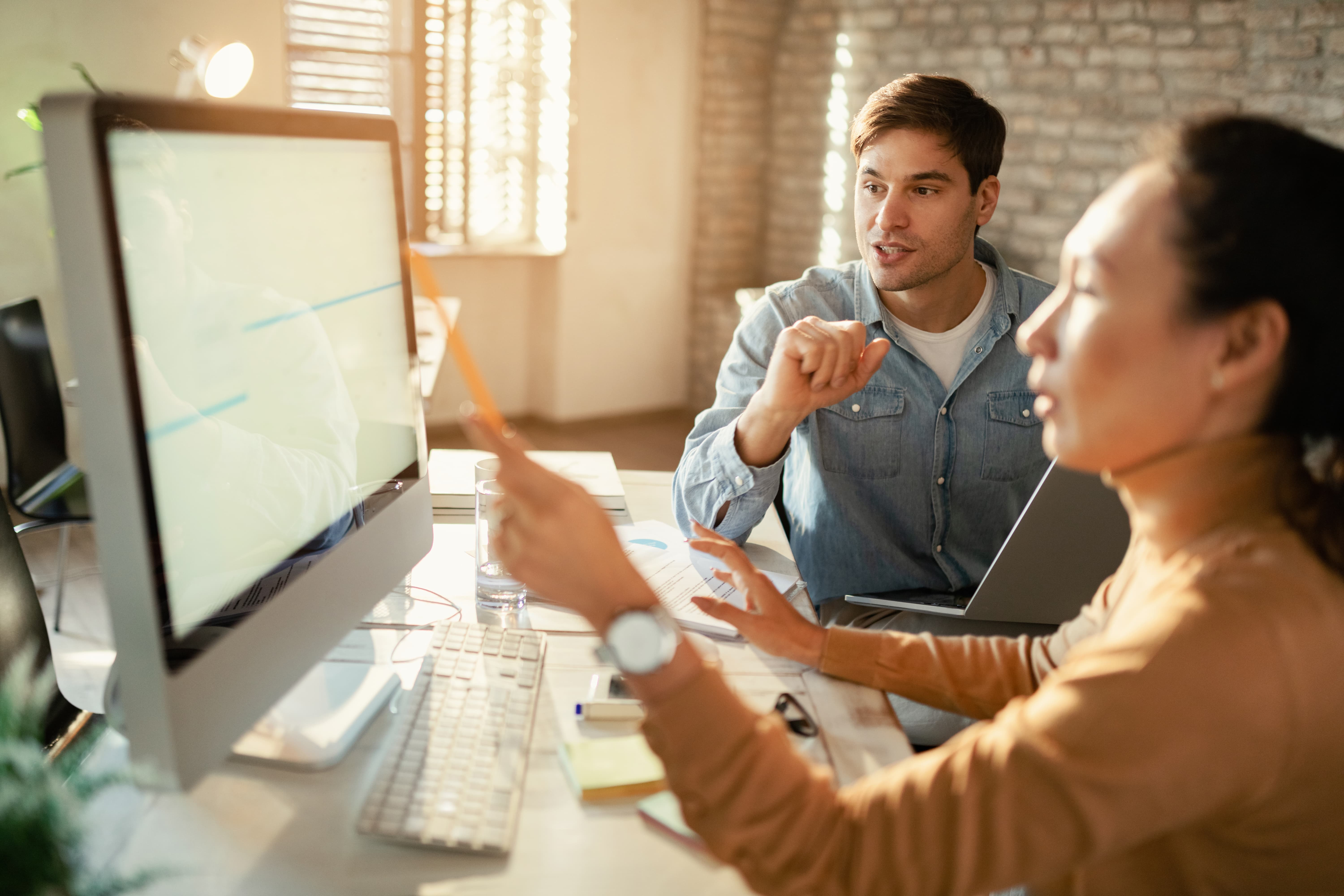 Employees looking at dashboards to see if there are business issues - compressed